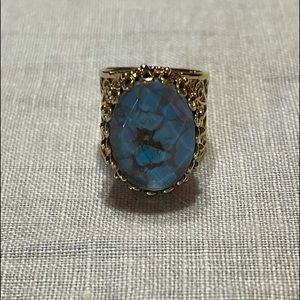Gold ring with blue stone